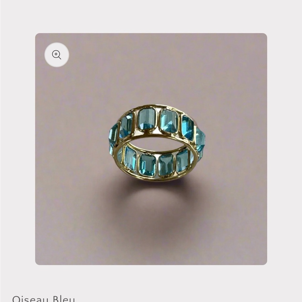 14K Blue topaz eternity ring by Oiseau Bleu.